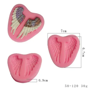 Dimensions and multi-angle views of a pink angel wing silicone mold for cake fondant