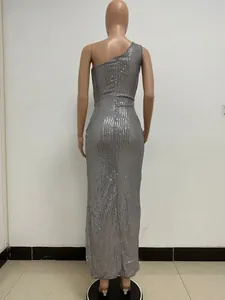 Elegant back view of a one-shoulder silver sequin long evening gown on a mannequin.