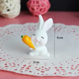 Miniature white rabbit figurine holding a carrot with 4cm height and 3cm width