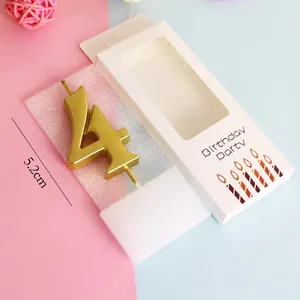 Golden number 4 birthday cake candle shown with packaging box and 5.2cm size measurement