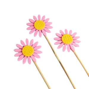 Set of three pink felt daisy sunflower cake toppers for birthday party baking decorations