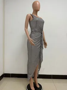 Detail of silver one-shoulder sequin dress with waist pleats and draped sash