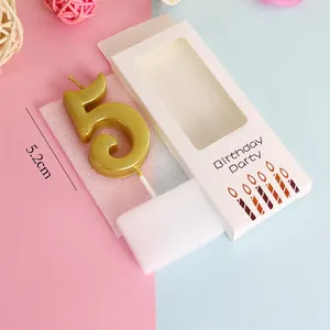 Close-up detail of golden number 5 birthday candle with packaging and 5.2cm size mark