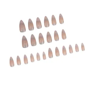Nude almond press-on nails with silver glitter gradient detail view for manicure