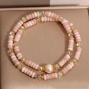 Elegant pink opal and pearl double-strand bracelet designed for a vintage luxury look.