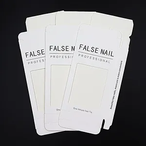 White cardboard packaging boxes with clear windows for false nails and manicures
