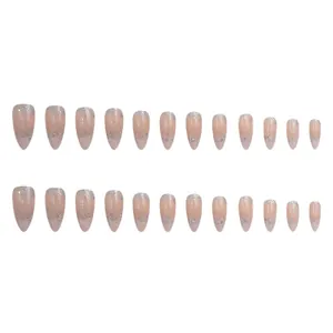 Detailed view of nude French press-on nails with sparkling silver glitter gradient tips