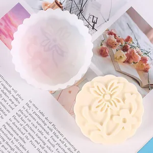 Detailed macro view of floral mooncake silicone mold and cast aromatherapy candle stone