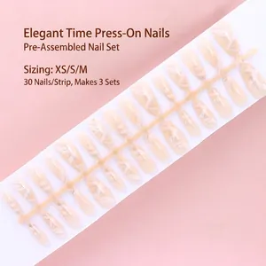 Close-up detail of 30pcs elegant nude marble press-on nail tips on a white display strip.