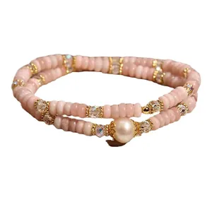 Elegant double-layer pink opal and pearl beaded bracelet for women in a vintage style.