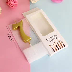 Golden number 7 birthday candle shown with 5.2cm height measurement and gift packaging