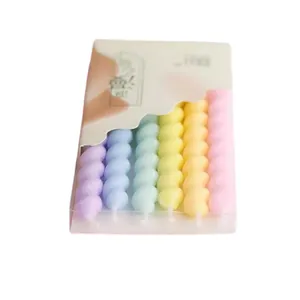 Pack of six colorful spiral heart-shaped birthday candles for party cake decoration