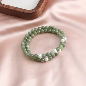 Detail shot of green jade double-strand bracelet with freshwater pearls