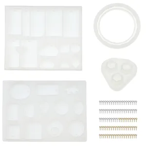 Detailed close-up showing various DIY resin pendant silicone molds and silver gold eye pins