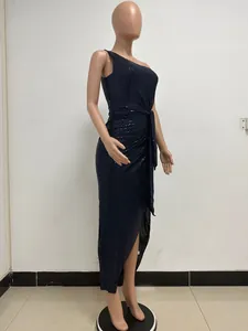 Detailed side view of elegant black one-shoulder sequin maxi dress on mannequin stand