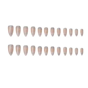 Elegant nude almond French press-on nails with silver shimmer and fine glitter accents