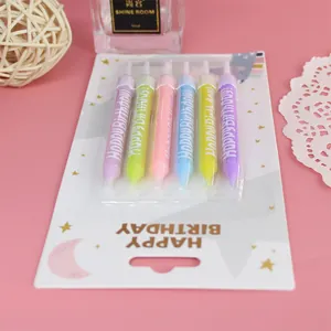 Close-up detail of a 6-pack of colorful Happy Birthday candles for cake topper decorations.