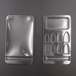 Detail view of transparent blister packaging trays for press-on nails and jewelry sets