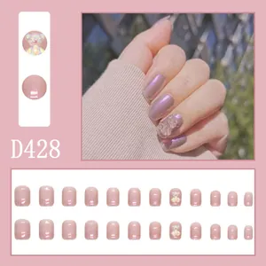 Detail view of shimmering lavender press-on nails with 3D bear charm, set of 24 tips.