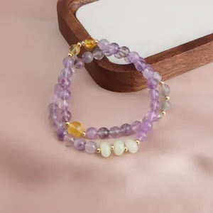 Elegant double-strand amethyst bracelet featuring sunstone and jade-like stone beads