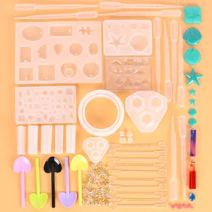 Overhead view of a comprehensive 229-piece DIY resin jewelry kit with various molds and tools