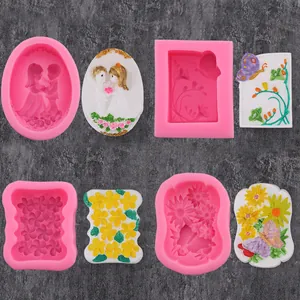 Detail view of sunflower and butterfly themed silicone molds with finished plaster models