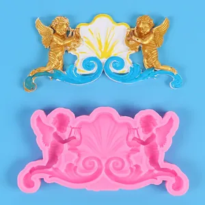 Detailed silicone mold and finished cherub angels with shell and wing patterns for baking