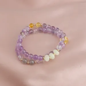 Macro view of a neo-Chinese double-strand bracelet featuring amethyst and mixed stone beads.