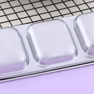 Close-up view of SUS 304 stainless steel condiment dish with authentic material stamp