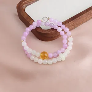 Detailed macro view of a New Chinese style double-strand Kunzite and Citrine beaded bracelet