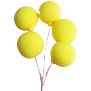 Yellow balloon clay cake toppers with wire stems for birthday party cake decoration