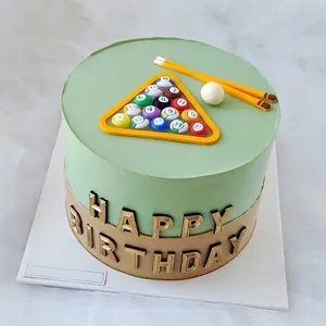 Detailed shot of billiard-themed PVC cake toppers with pool cues and colored balls