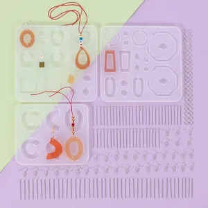 Detailed view of 229-piece DIY resin mold set with silicone molds and metal accessories