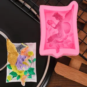 Macro view of a pink flower fairy silicone mold with its finished colorful resin cast.