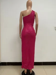 Back view of a hot pink one-shoulder sequin maxi dress displayed on a dress form.