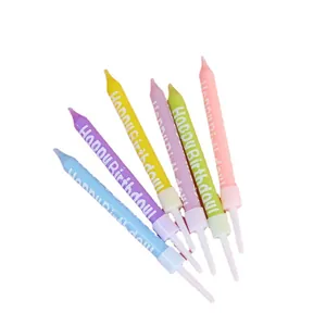 Set of six colorful birthday candles with Happy Birthday text for cake decoration.