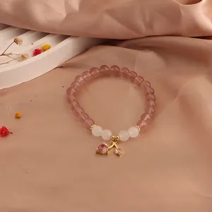 Elegant strawberry quartz and moonstone beaded bracelet with a pink cherry heart pendant