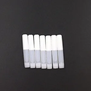Set of seven small white and translucent applicator tubes for nail or cosmetic use