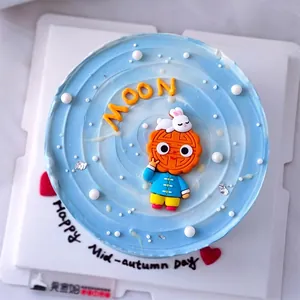 Close-up of cute Mooncake boy and rabbit cake topper for Mid-Autumn festival decoration