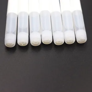 Detailed close-up view of white translucent plastic tubes for nail art packaging