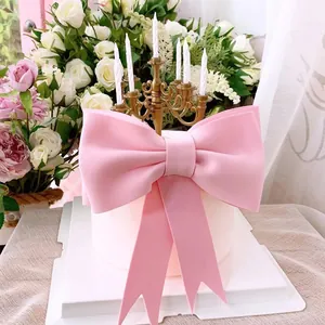 Élégante grande décoration de gâteau nœud rose pour fête d'anniversaire de princesse