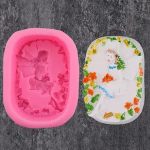 Detail of fairy and sunflower relief on silicone mold and finished soap ornament