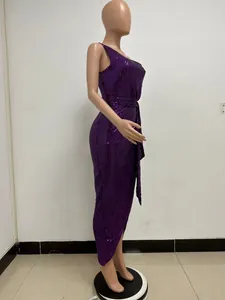 Detailed side view of elegant purple sequined one-shoulder dress with pleated waist and sash