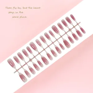 Detailed view of pink blush cat-eye press-on nails arranged on a plastic display strip.