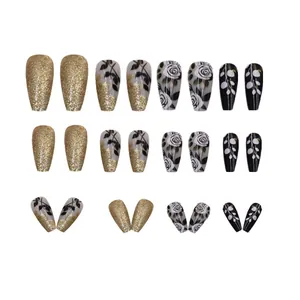 Elegant medium-long coffin press-on nails with black gold rose and glitter patterns