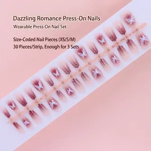 Detailed view of mauve gradient press-on nails featuring white butterfly patterns and glitter