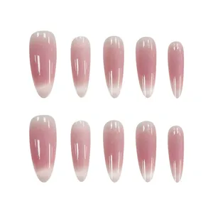Macro view of almond-shaped press-on nails with pink blush cat-eye shimmer effect