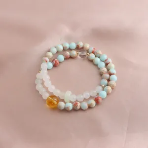 Elegant double-strand bracelet with colorful natural stones and a vibrant citrine bead.