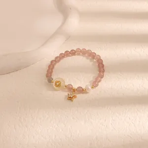Elegante bracciale di perle con quarzo fragola rosa e ciondolo a stella dorata lucido