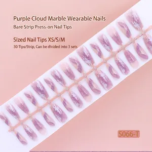 Detailed view of purple cloud marbling press-on nail strip containing 30 individual pieces